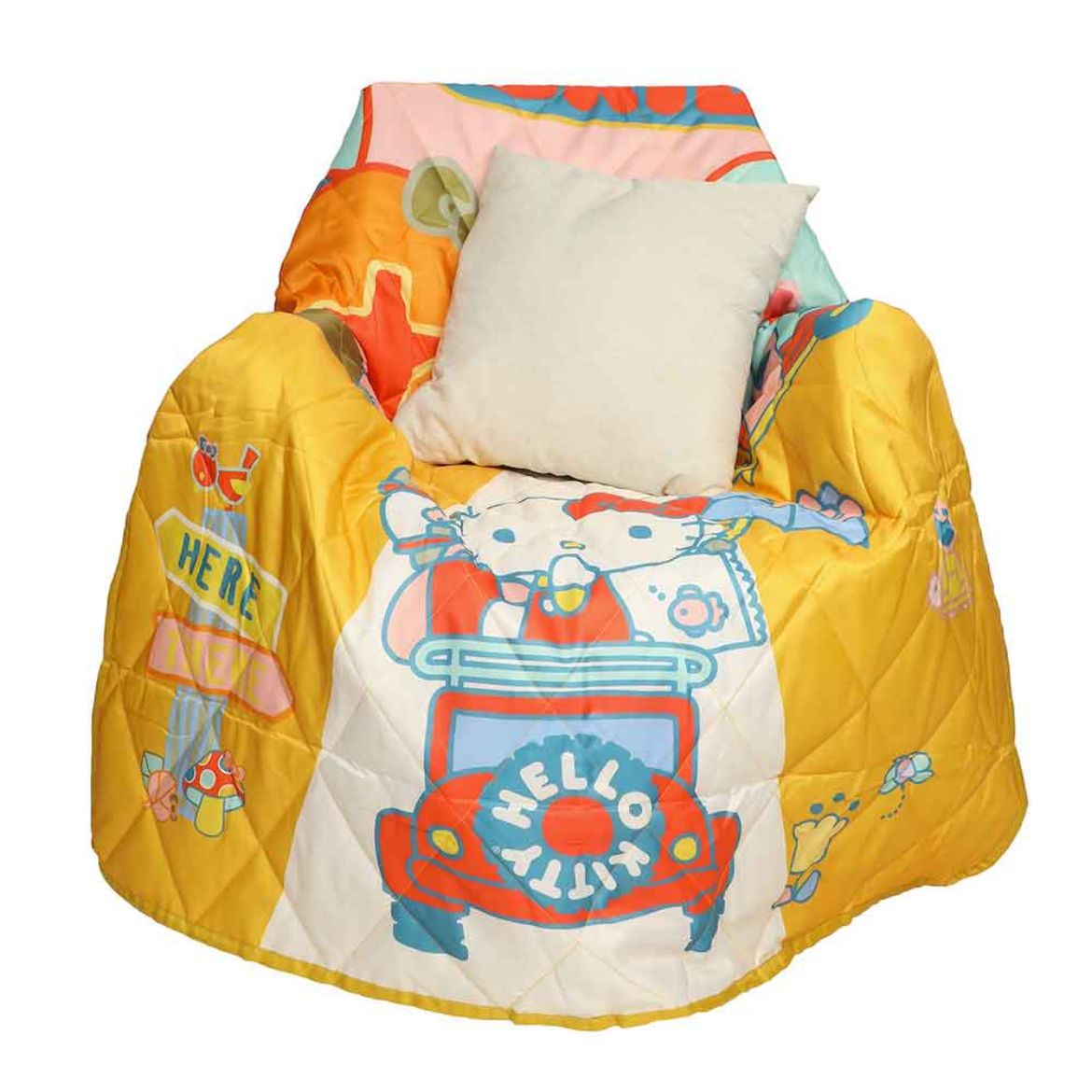 Outdoor throw blanket with Hello Kitty graphic draped over a camping chair at sunset