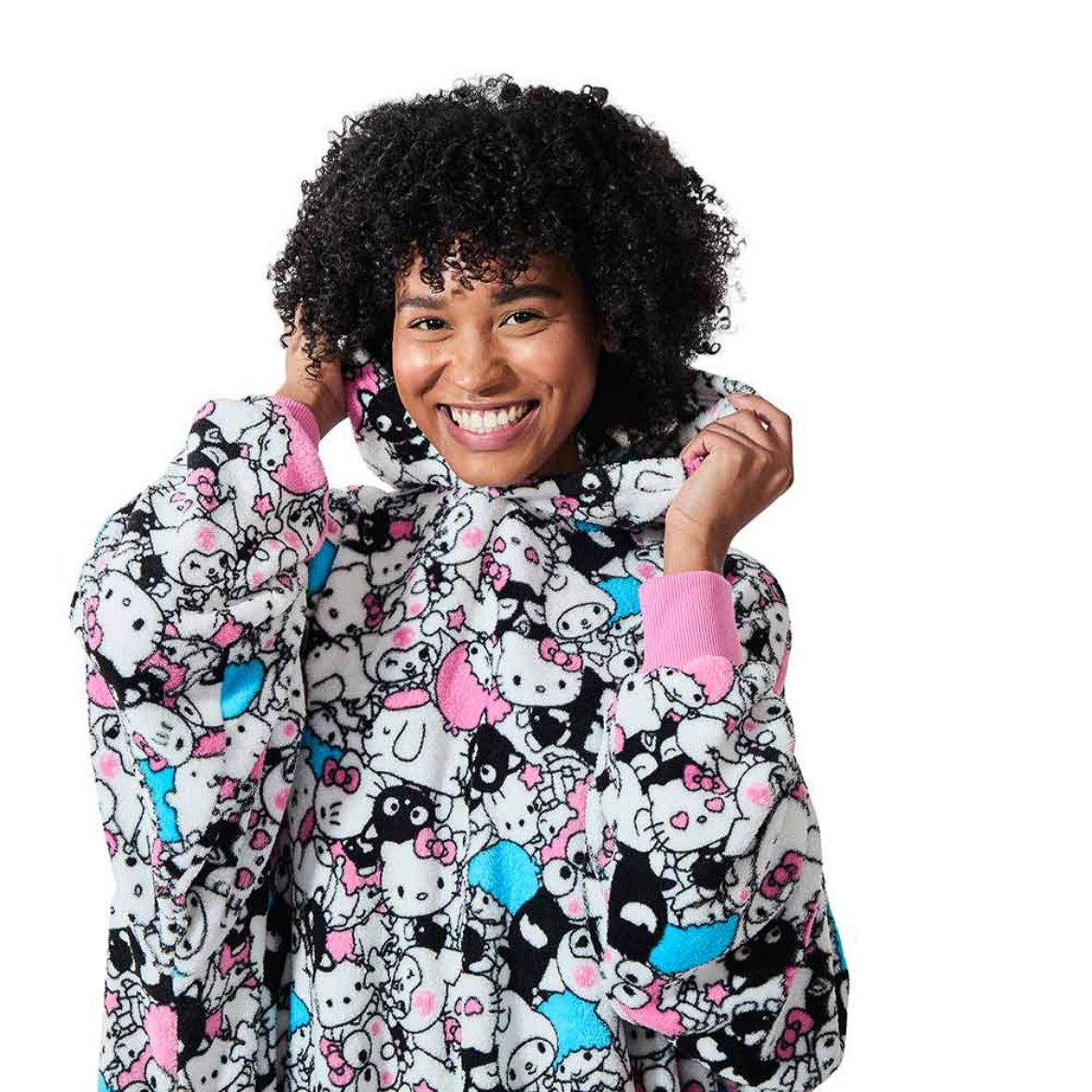 Person wearing Hello Kitty and Friends hoodie during a movie night.