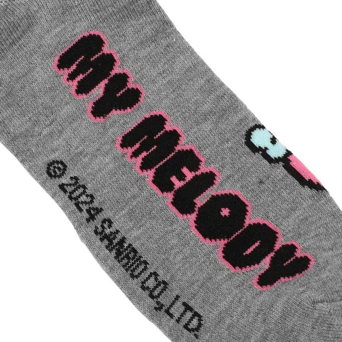 Cinnamoroll character crew socks in a cozy display.