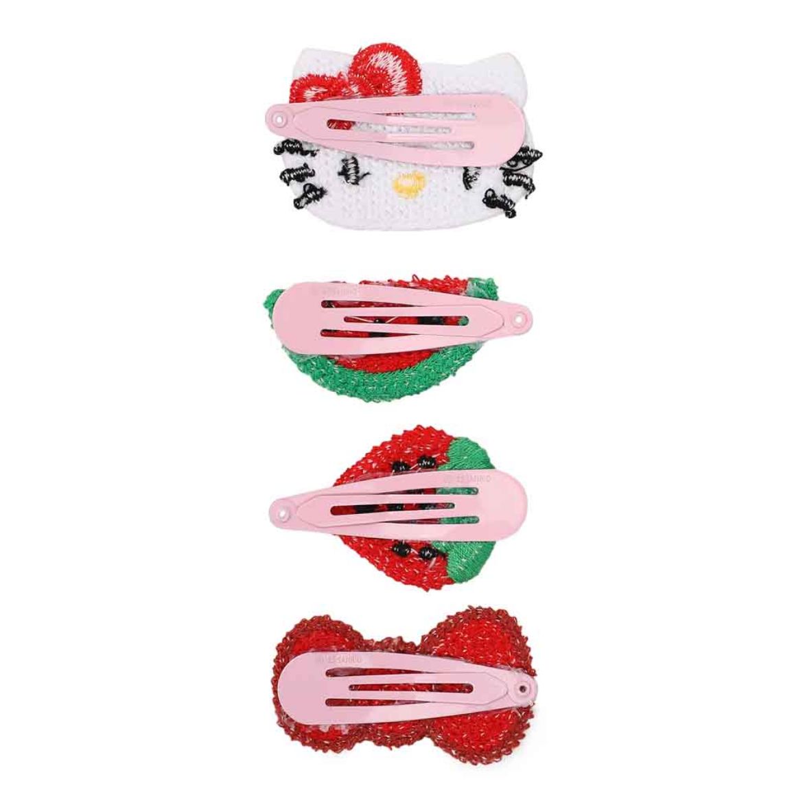 Four Hello Kitty crochet hair clips laid out, demonstrating their size and detail