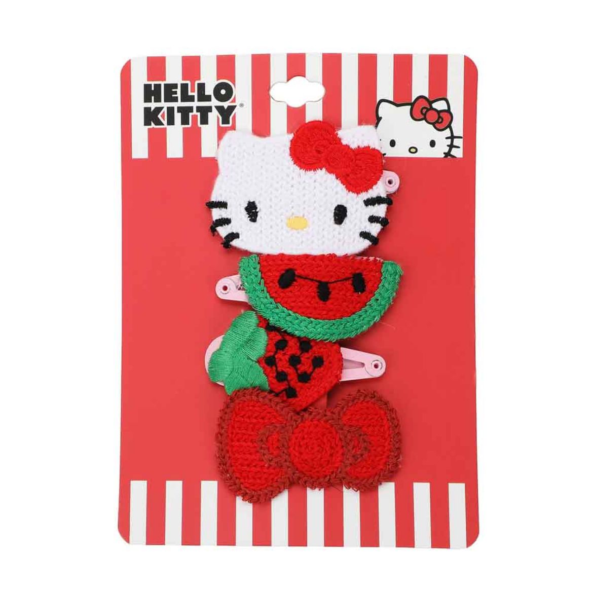 Four Hello Kitty crochet hair clips laid out, demonstrating their size and detail