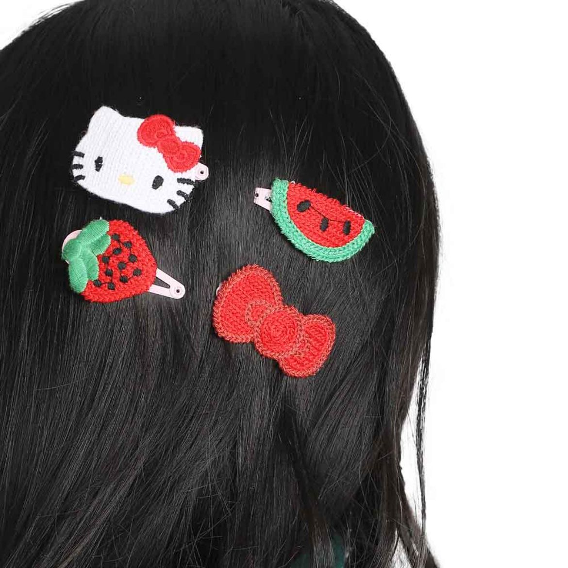 Close-up of a single Hello Kitty crochet hair clip, highlighting its machine crochet design