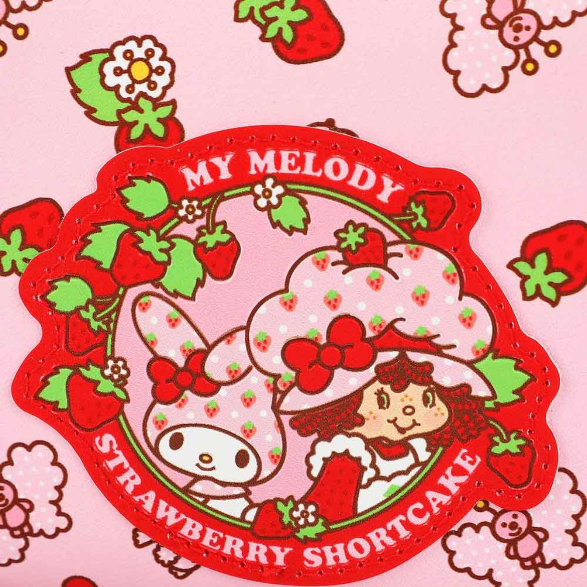 Close-up of the large cosmetic bag with all-over print of My Melody and Strawberry Shortcake characters