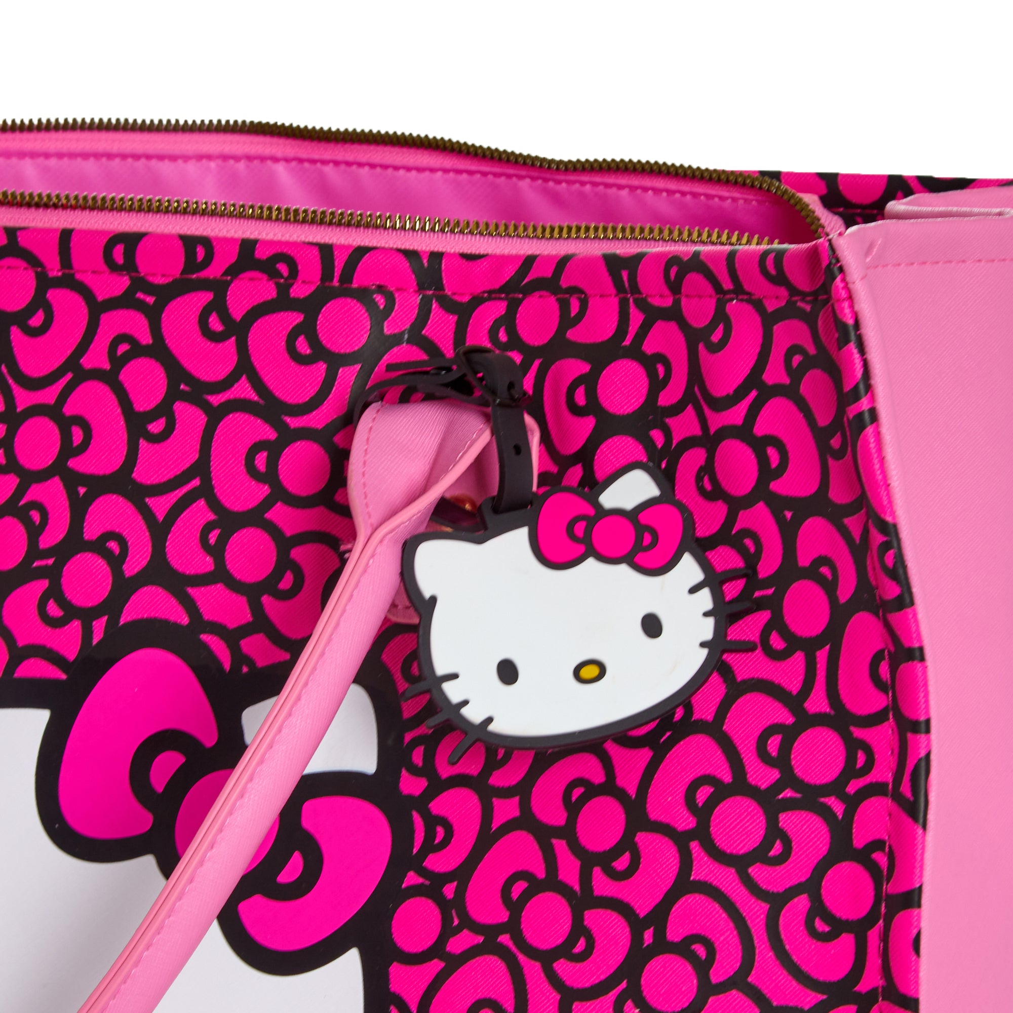 Personalized Hello Kitty luggage tag attached to a travel bag