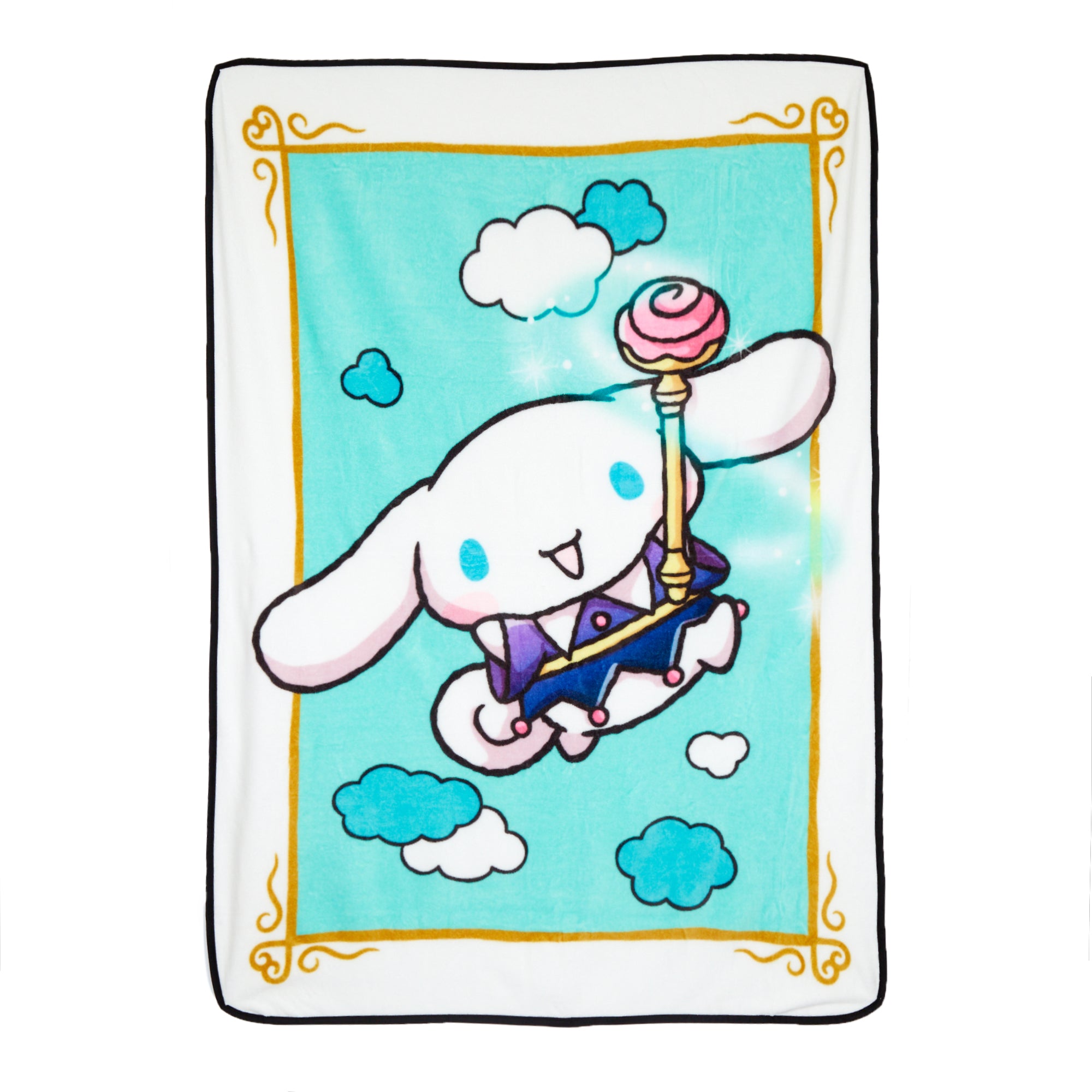Folded plush fleece blanket showcasing Cinnamoroll and wand motif on a couch