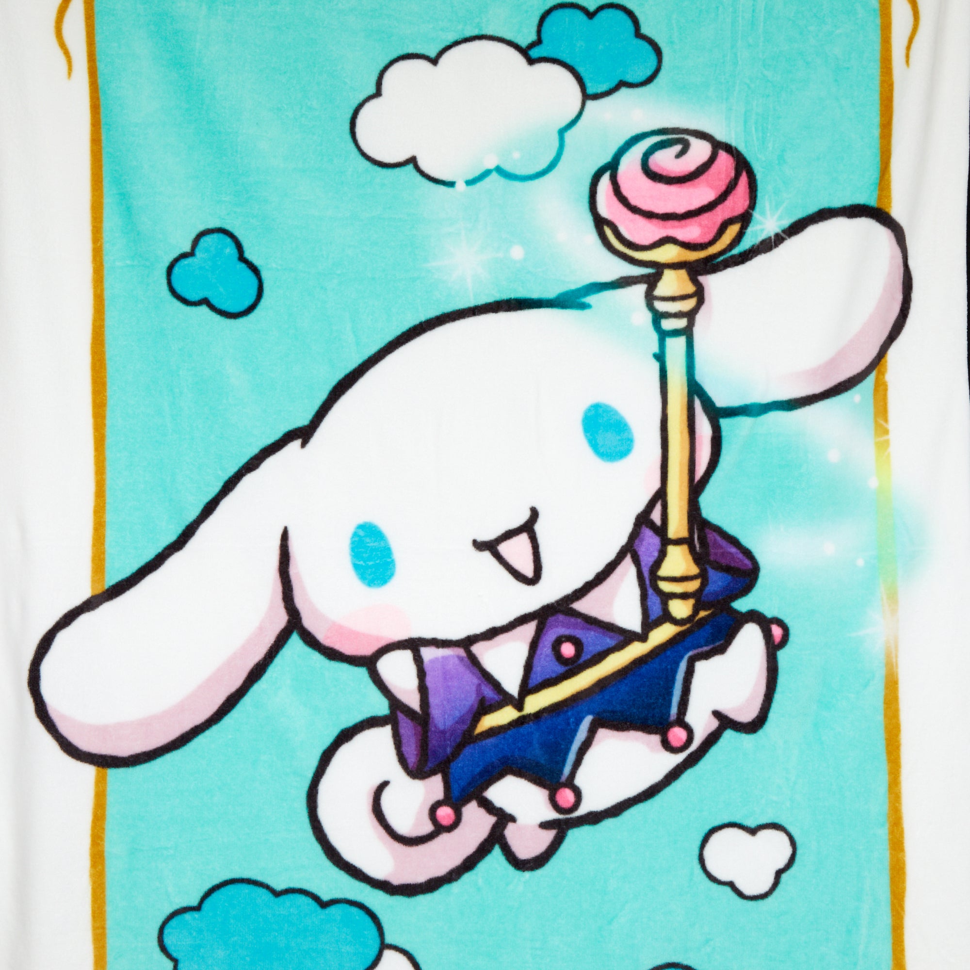 Cinnamoroll throw blanket laid out across a king-size bed for scale