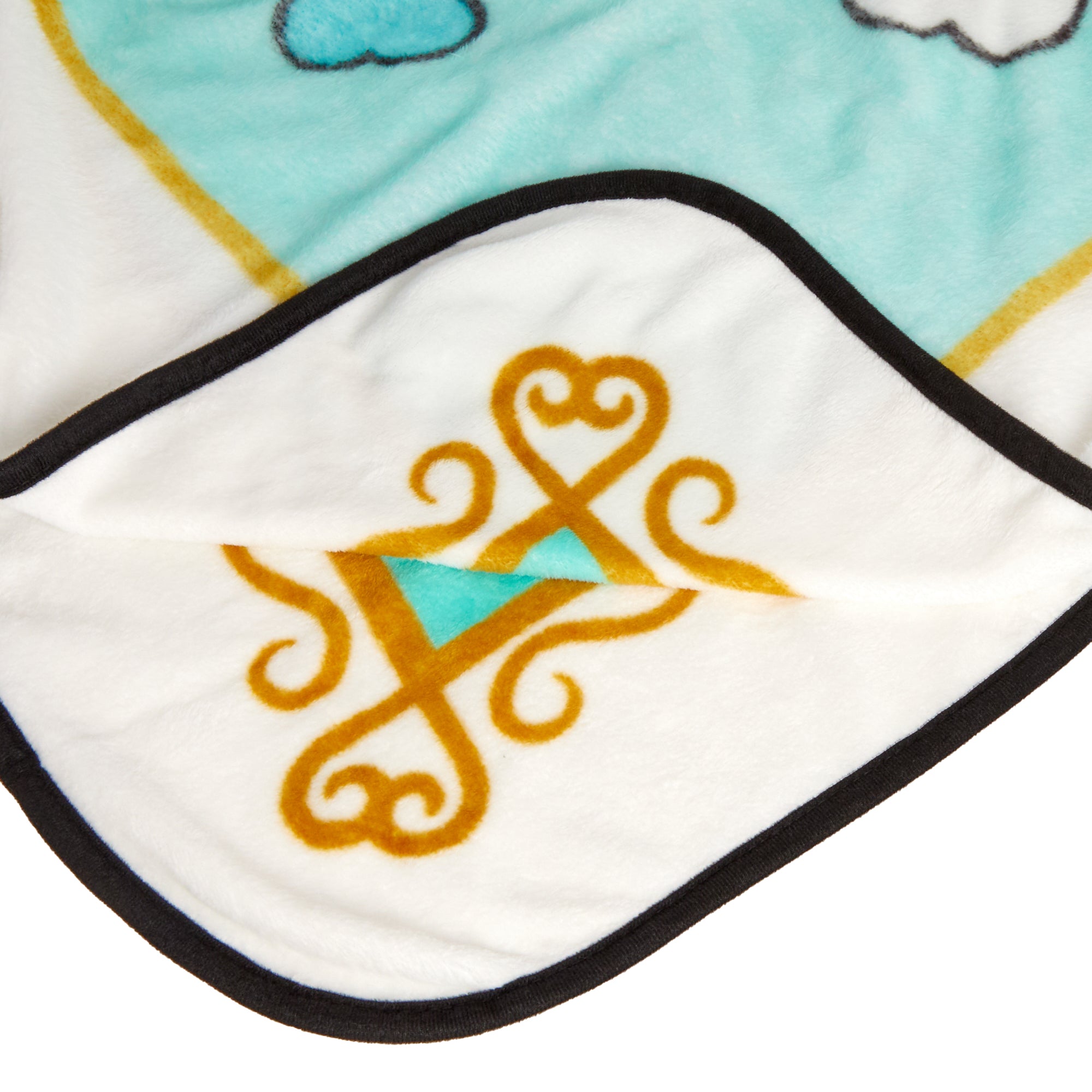 Folded plush fleece blanket showcasing Cinnamoroll and wand motif on a couch
