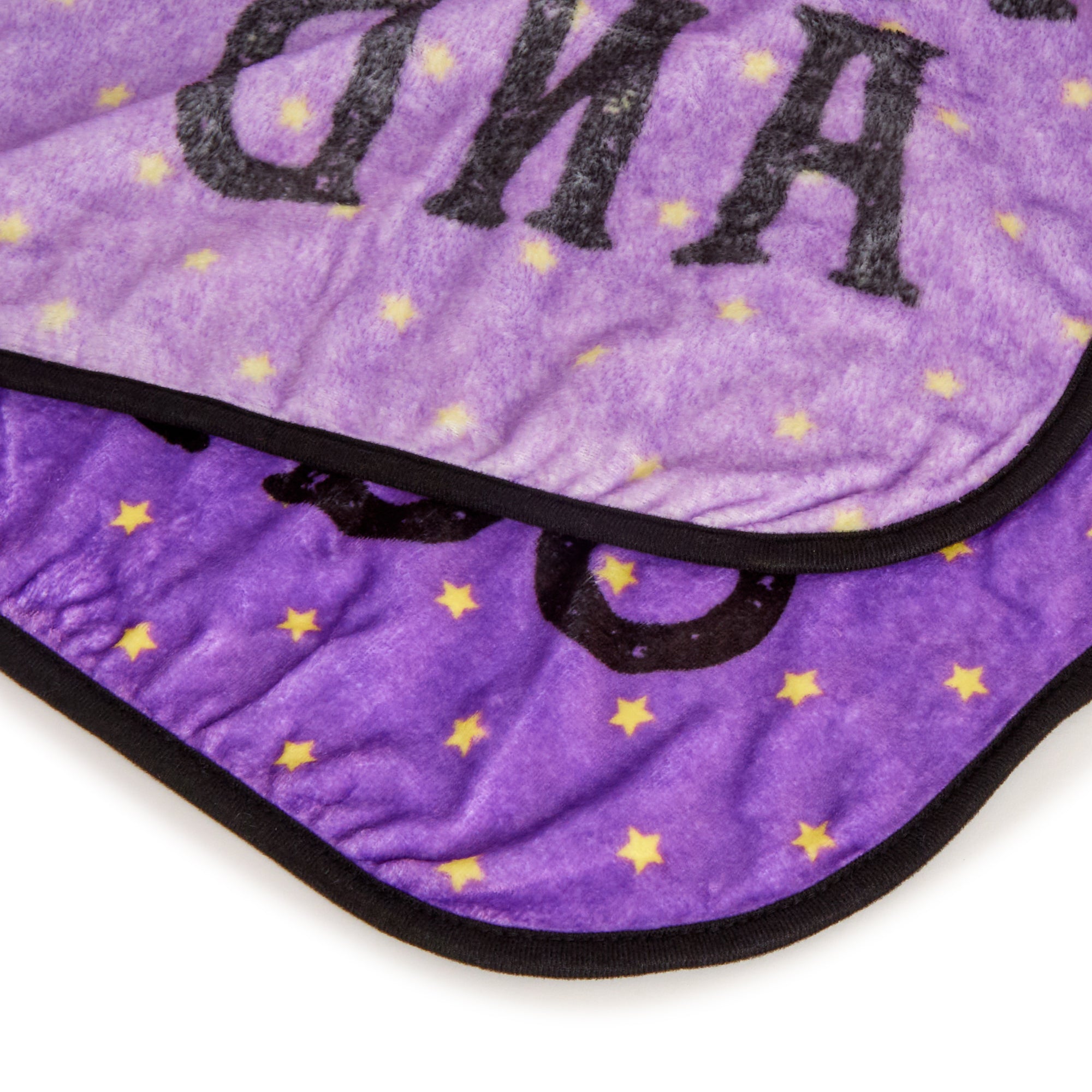 Hello Kitty throw blanket draped over a sofa for Halloween decor.