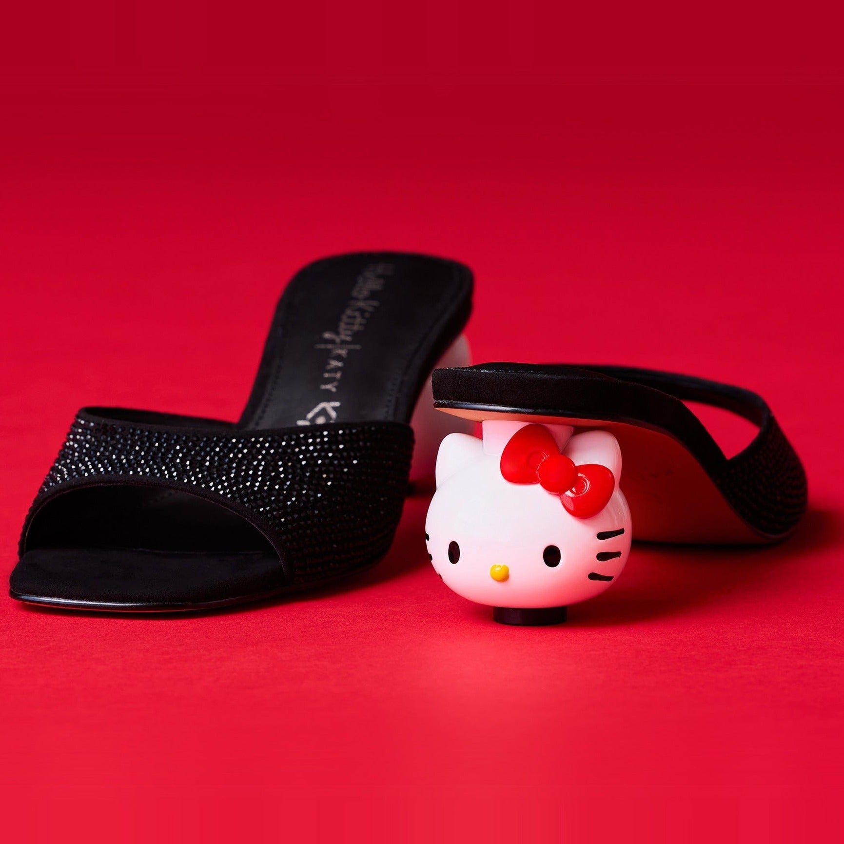 Woman wearing Hello Kitty sandals with summer dress in park setting