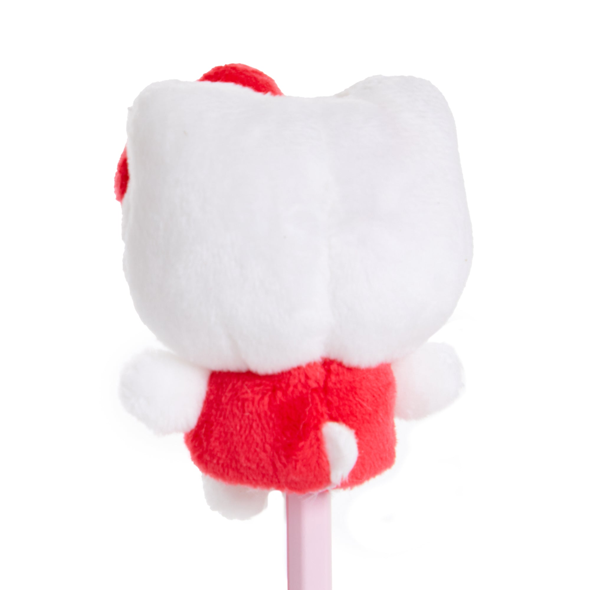 Hello Kitty pencil topper displayed on a notebook alongside other kawaii stationery