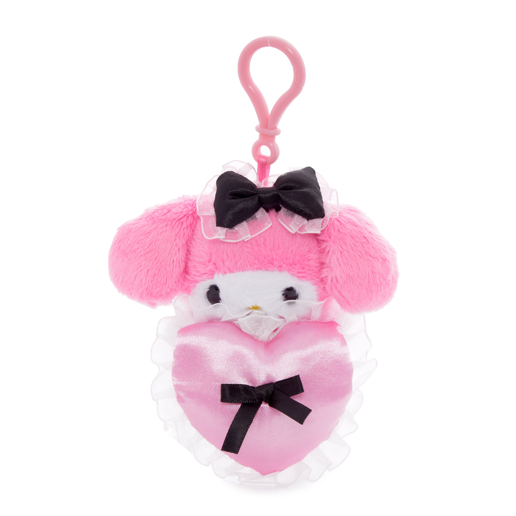 Close-up of Kuromi mascot clip attached to a pastel tote near a window
