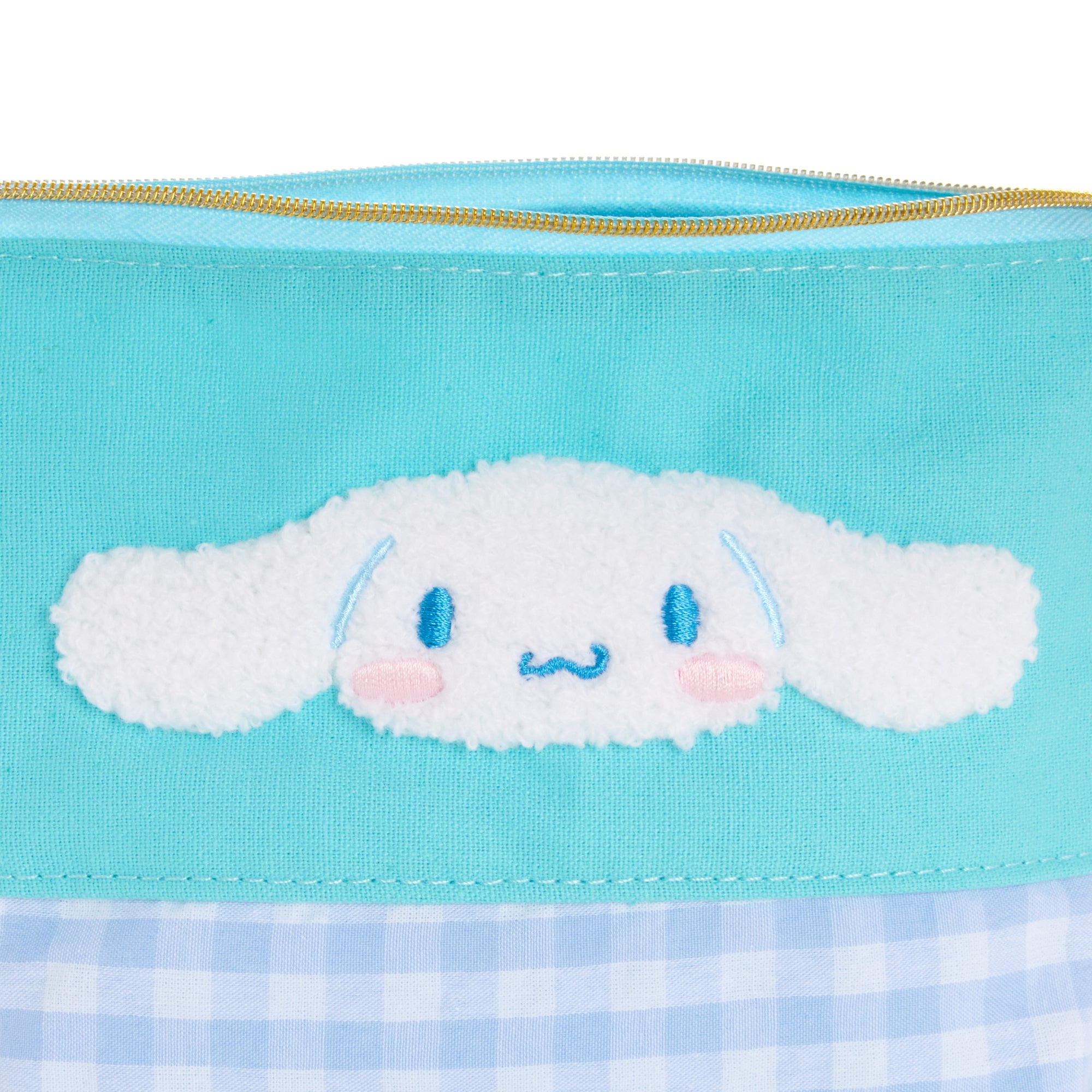 Close-up of Cinnamoroll accessories in a stylish zipper pouch.