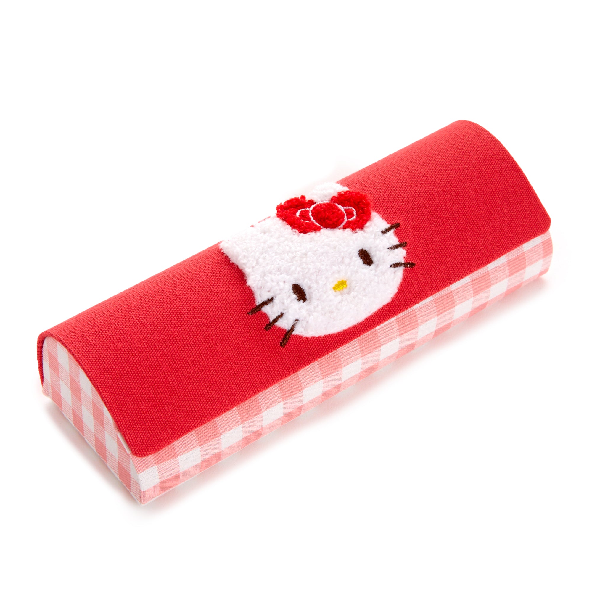 Sanrio Hello Kitty case displayed on a vanity with other accessories.