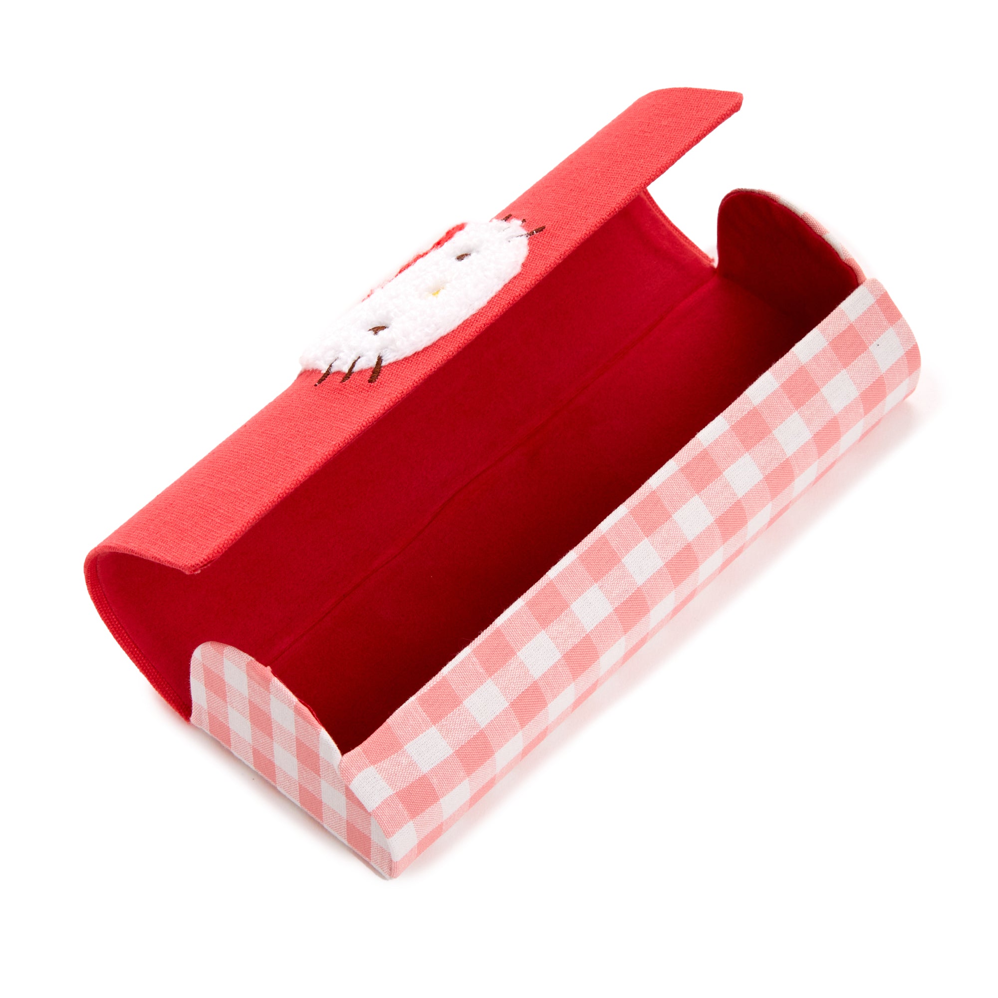 Close-up of the gingham-patterned eyewear case next to a pair of sunglasses.