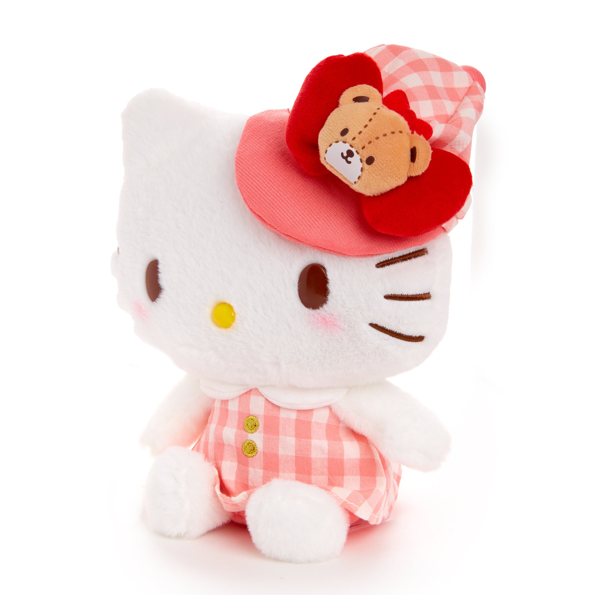 Hello Kitty plush displayed with other Sanrio plush toys, perfect for shelf styling.