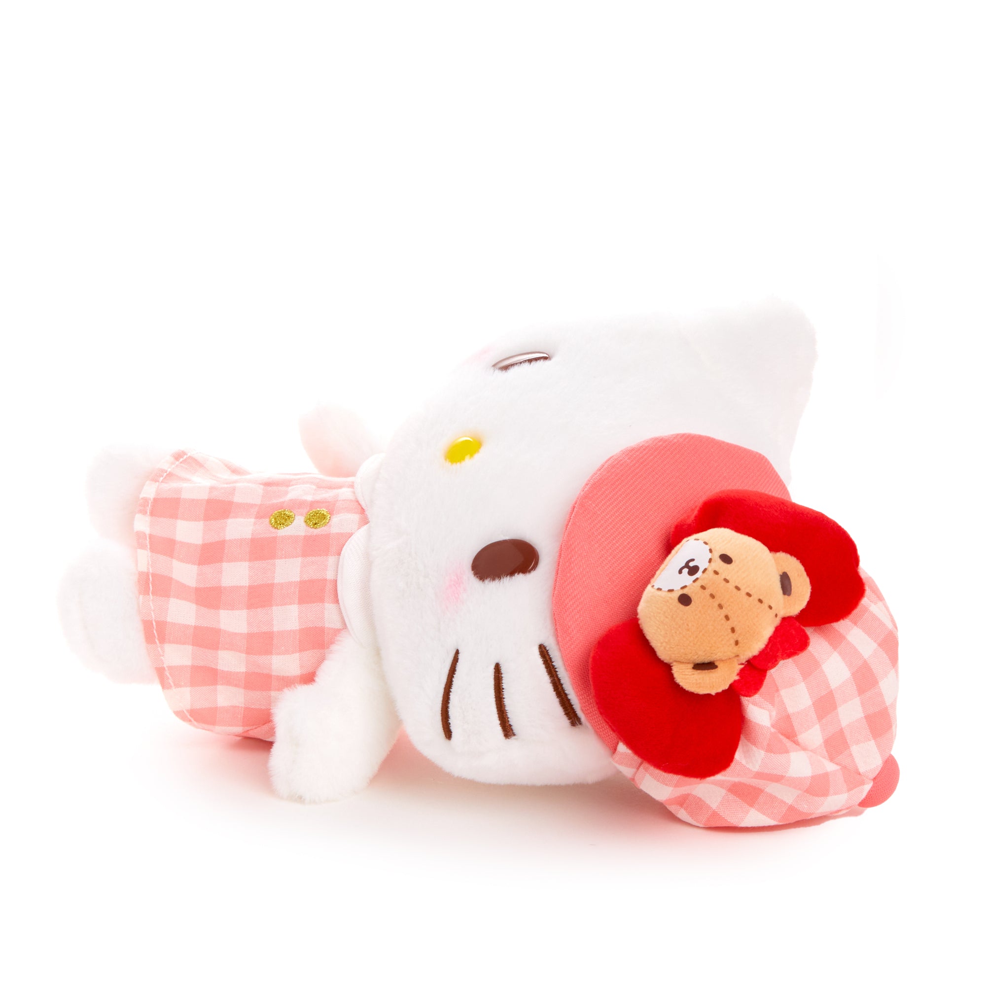Hello Kitty plush displayed with other Sanrio plush toys, perfect for shelf styling.