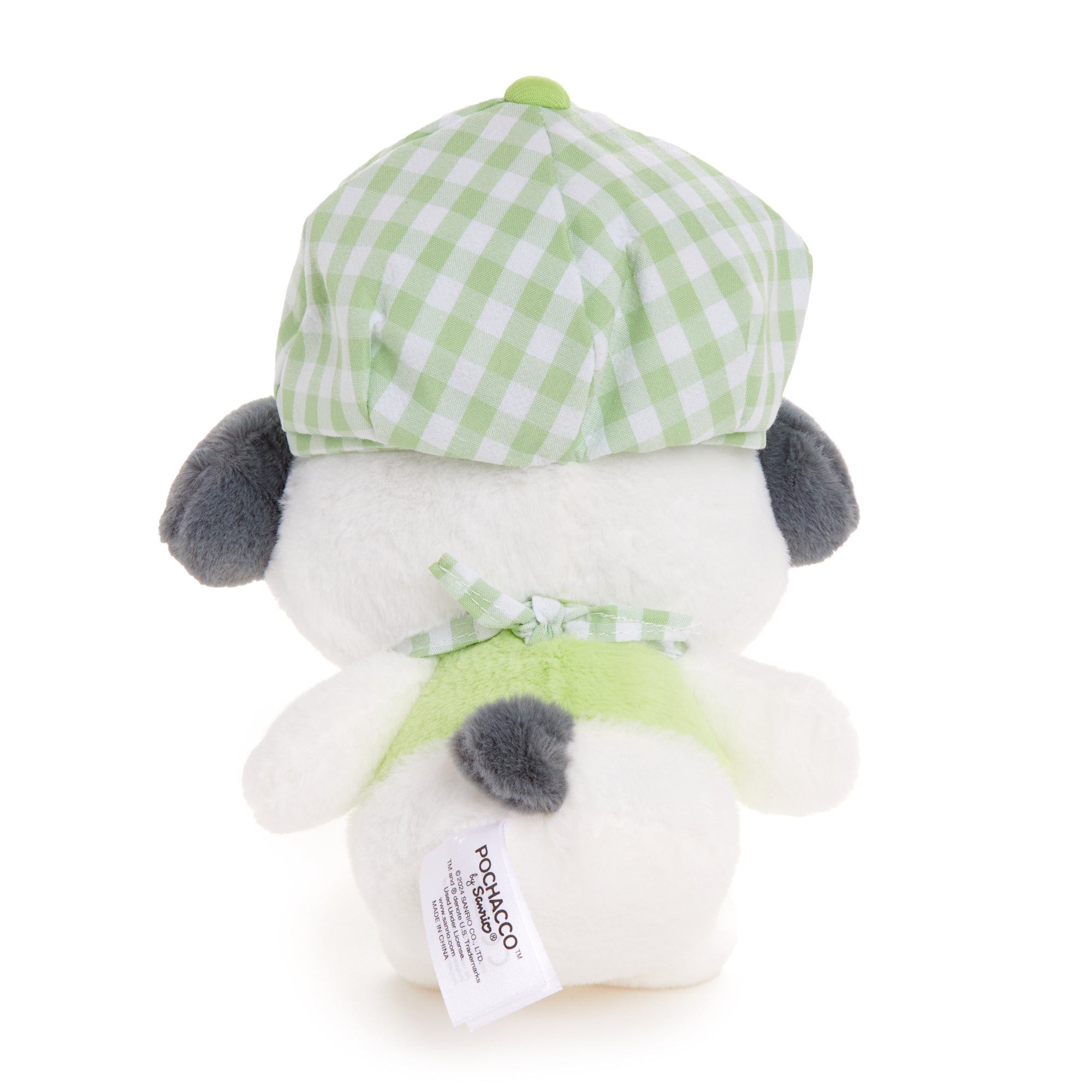Pochacco collectible plush next to a coffee cup for scale