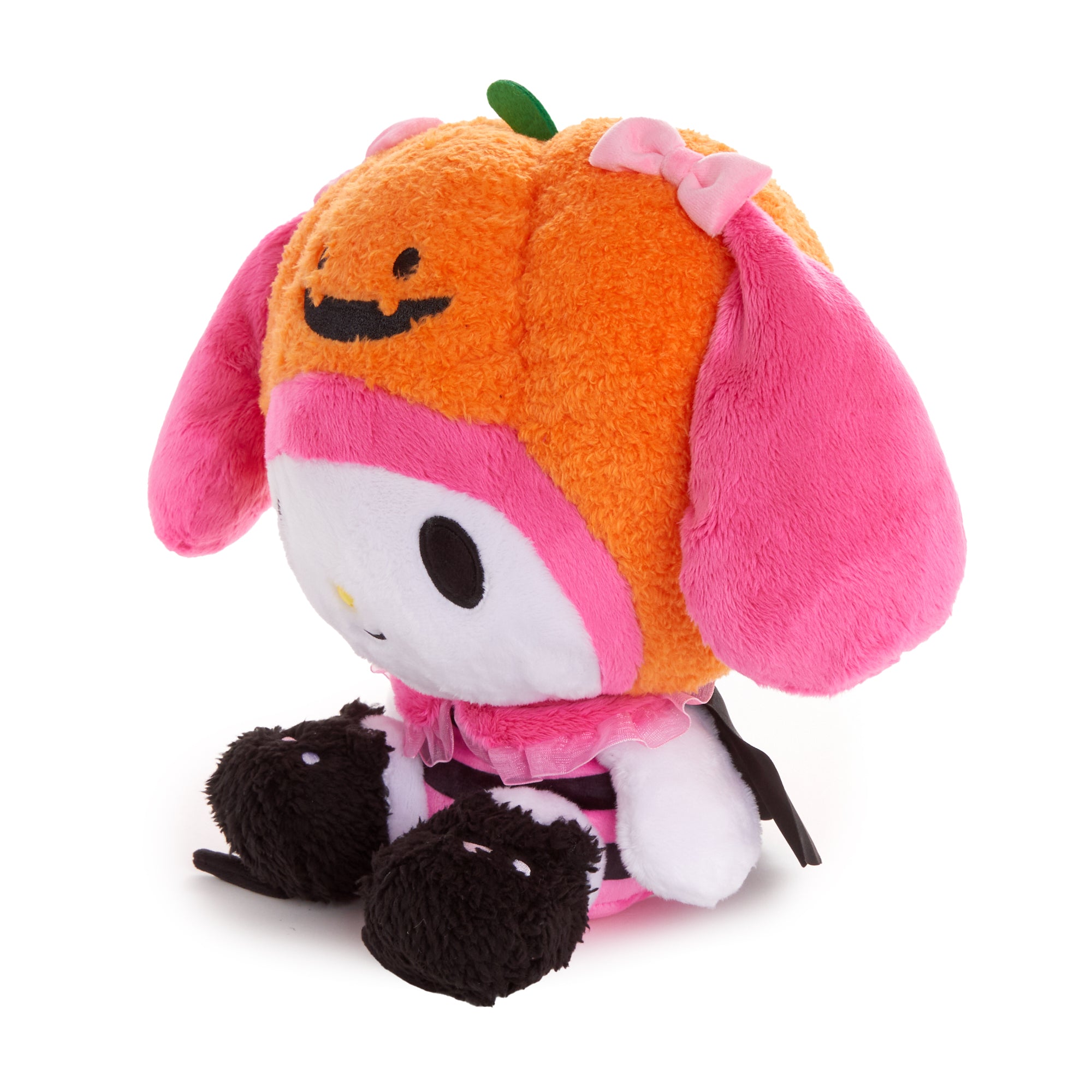 My Melody Halloween plush toy sitting on a Halloween-themed background