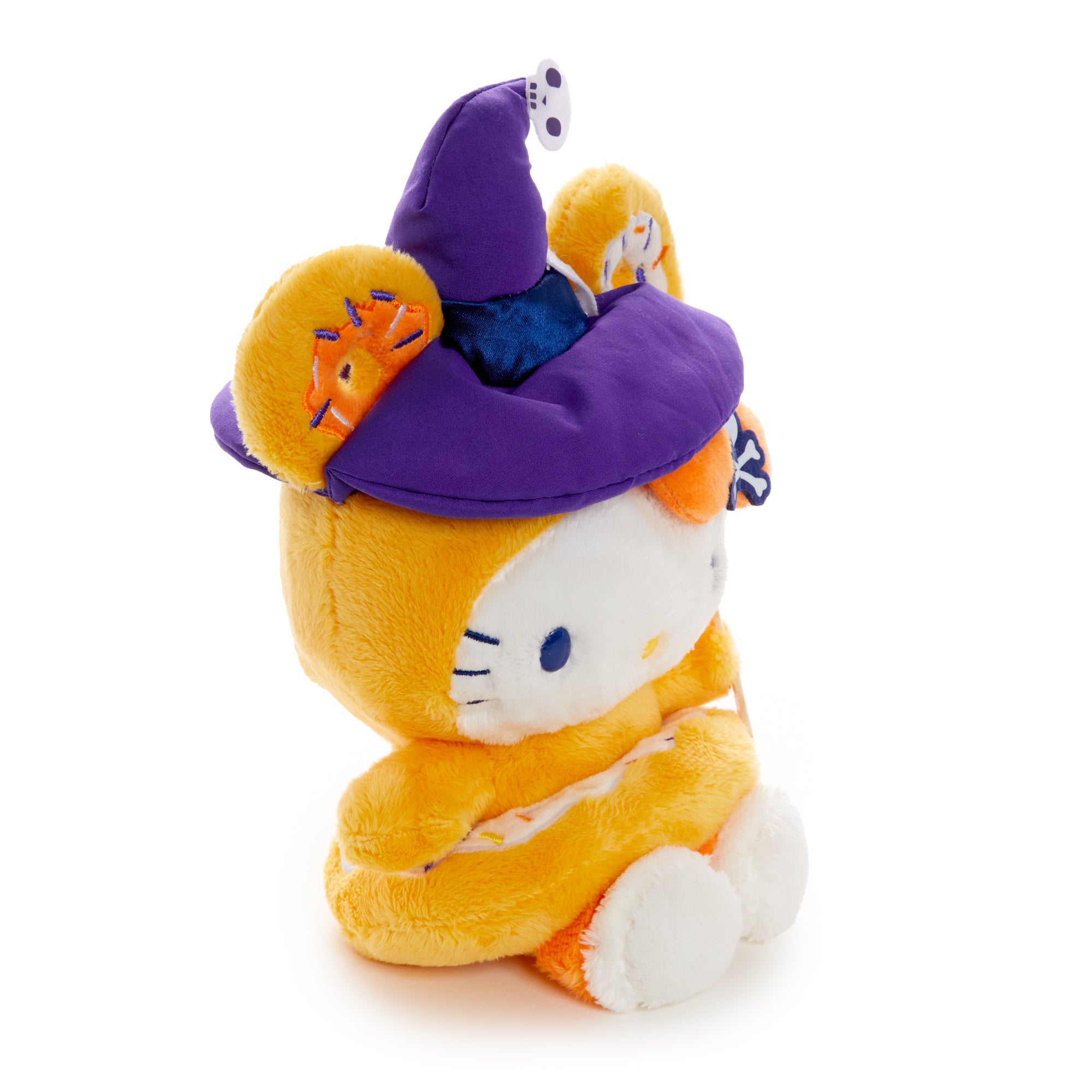 Front view of Hello Kitty Witchy Donut plush on a Halloween-themed background