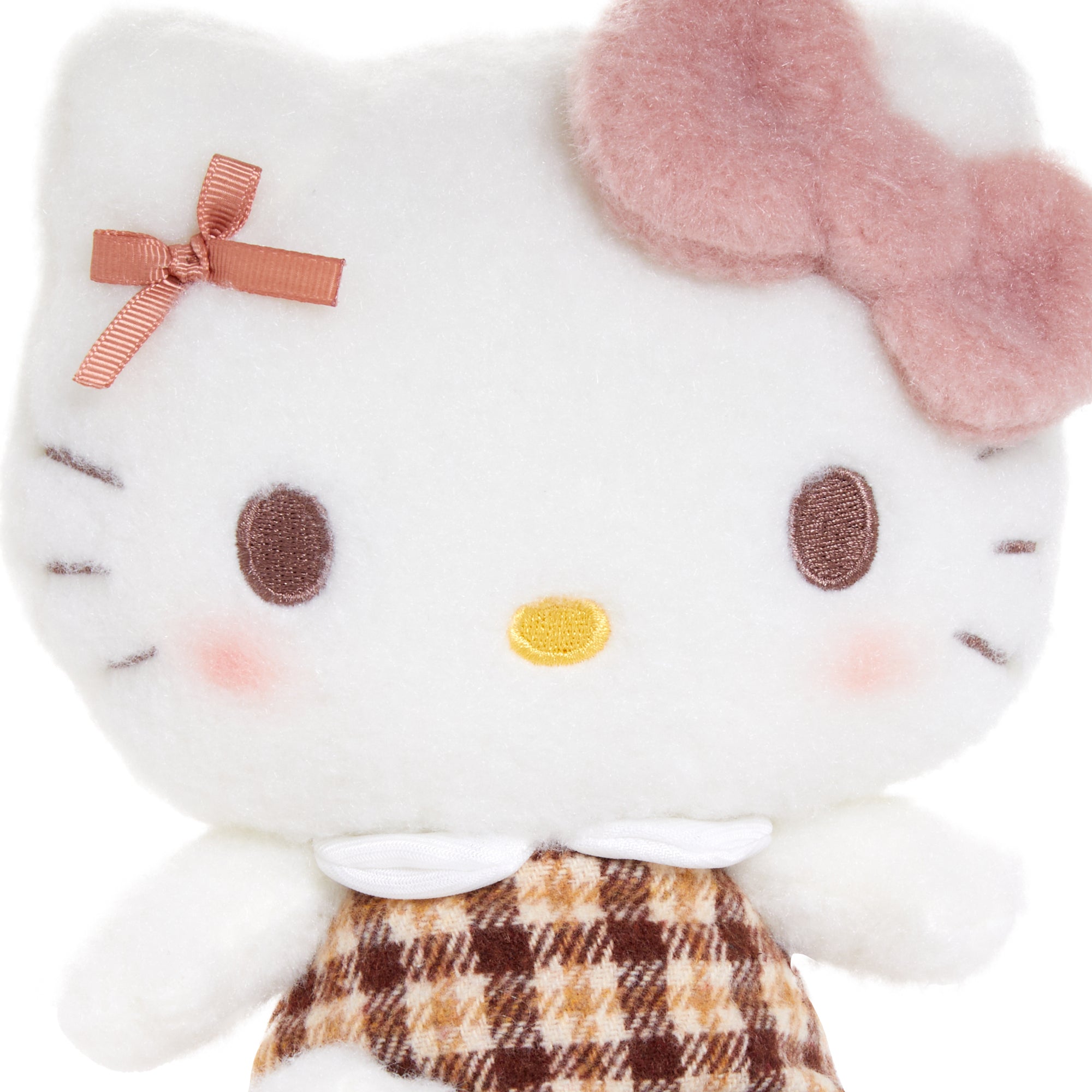 Big Hello Kitty plush toy with hand-painted cheeks and soothing mocha tones, perfect for bedroom decor