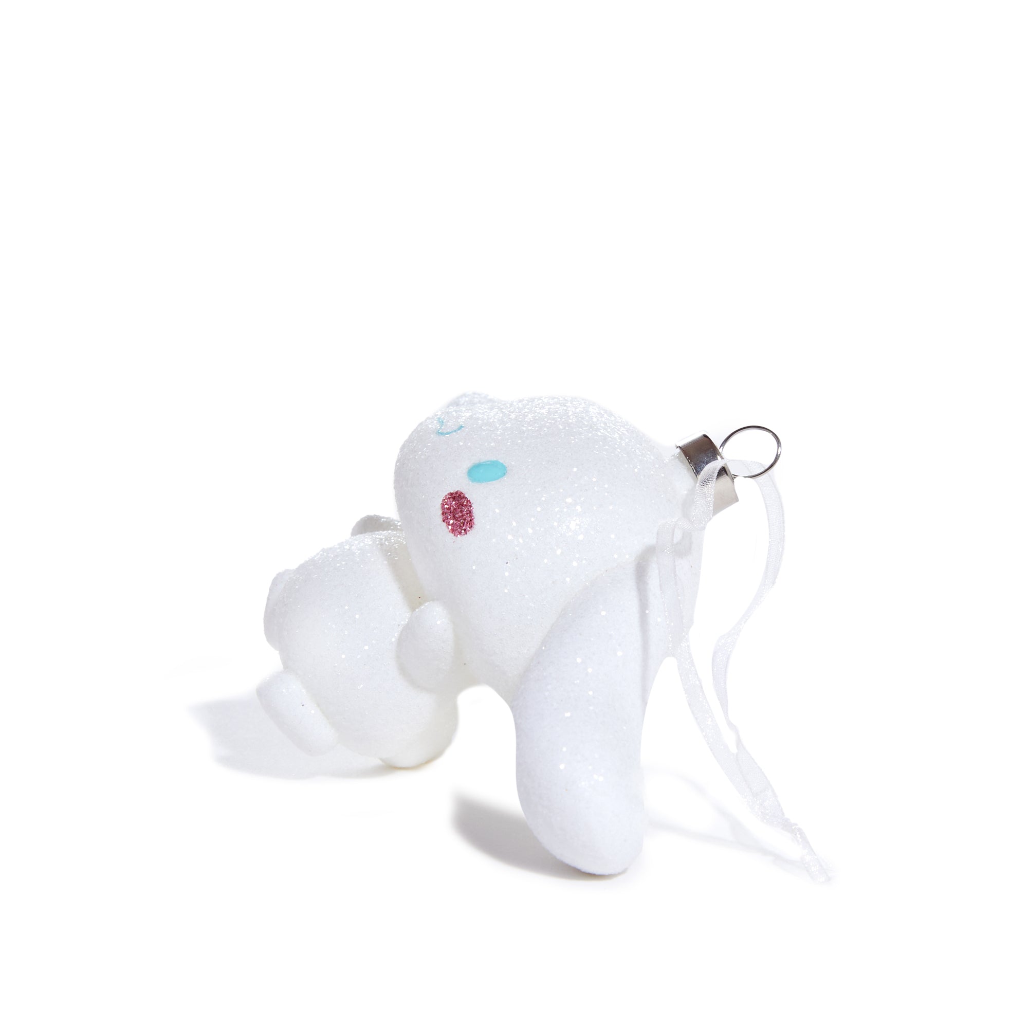 Front view of blown glass ornament featuring Cinnamoroll’s iconic silhouette, hung on a snow-dusted tree.