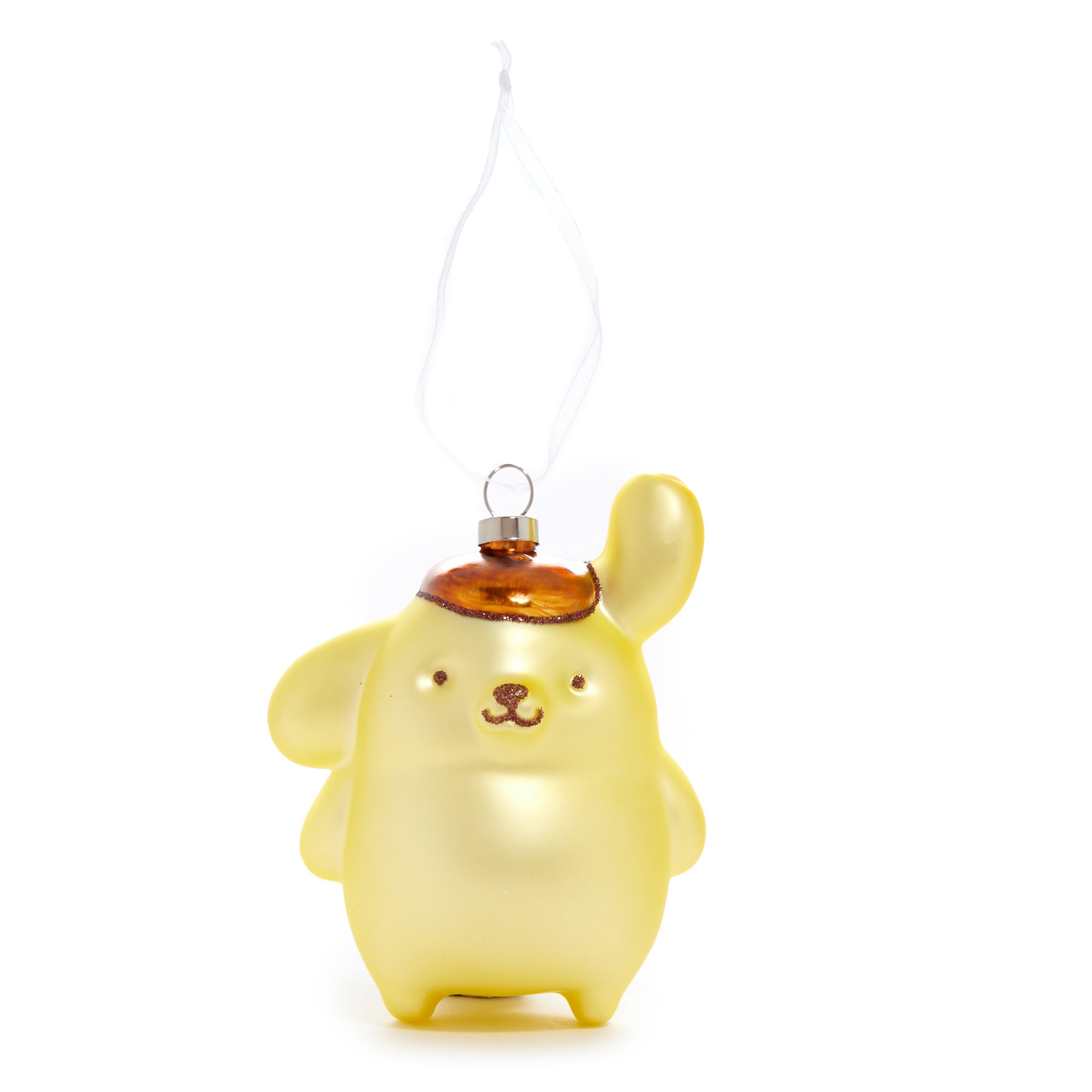 Pompompurin ornament displayed on a holiday-themed table setting.