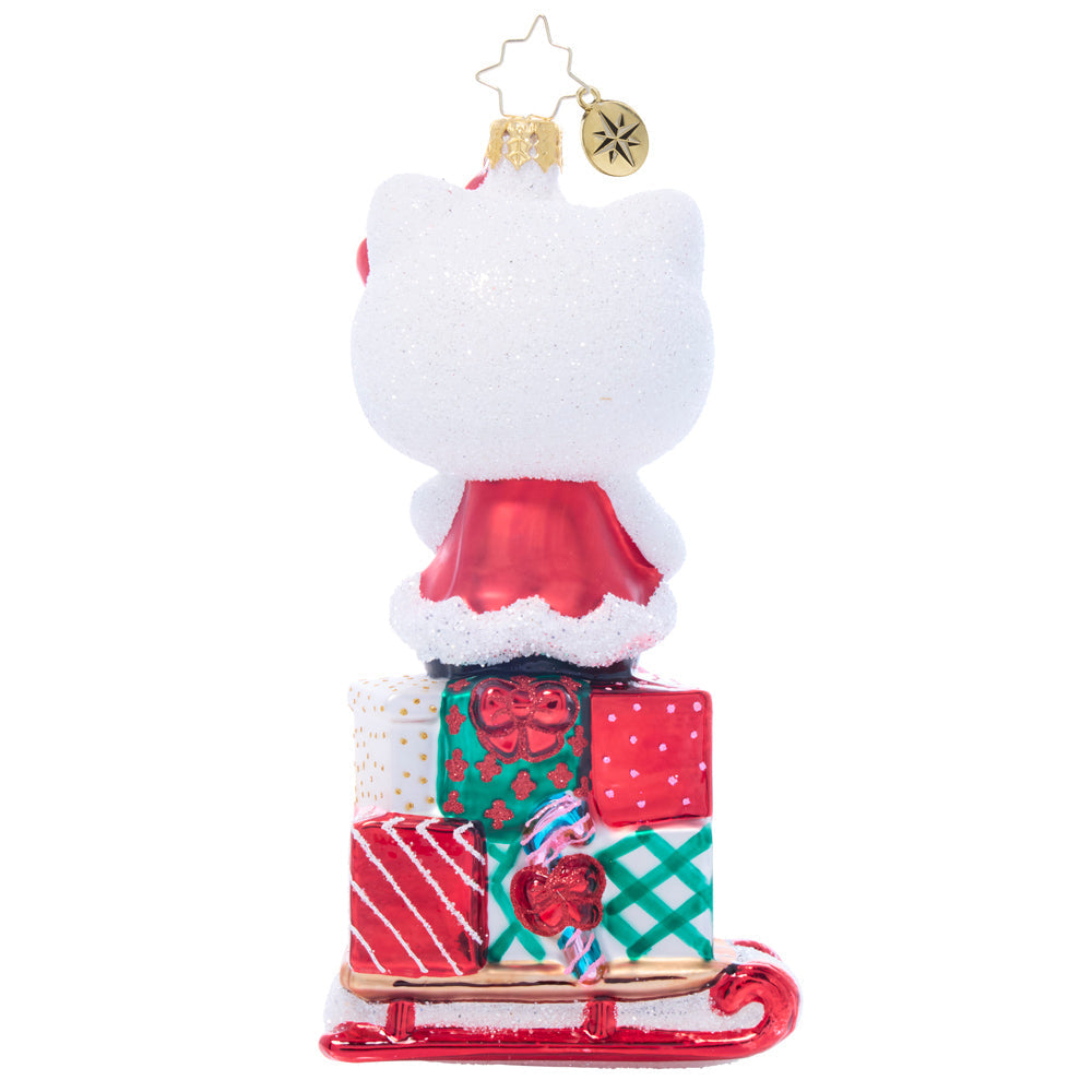 Decorative Hello Kitty glass blown ornament displayed with holiday lights