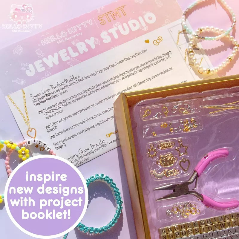 Close-up of Hello Kitty charms and gold jewelry components from the kit