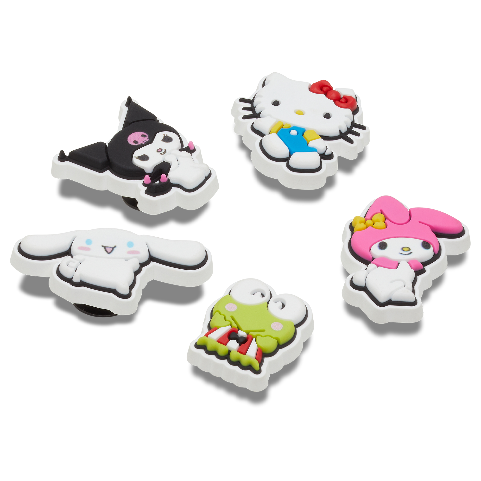 Overhead view of hello kitty croc charms set arranged near white Crocs clogs.