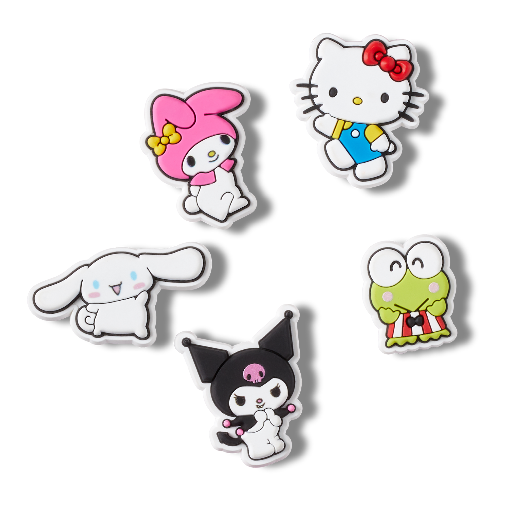 Overhead view of hello kitty croc charms set arranged near white Crocs clogs.