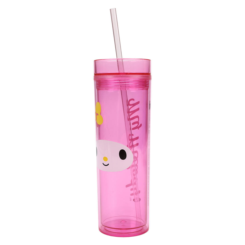 Hand holding the acrylic travel tumbler in a sunny California park setting.