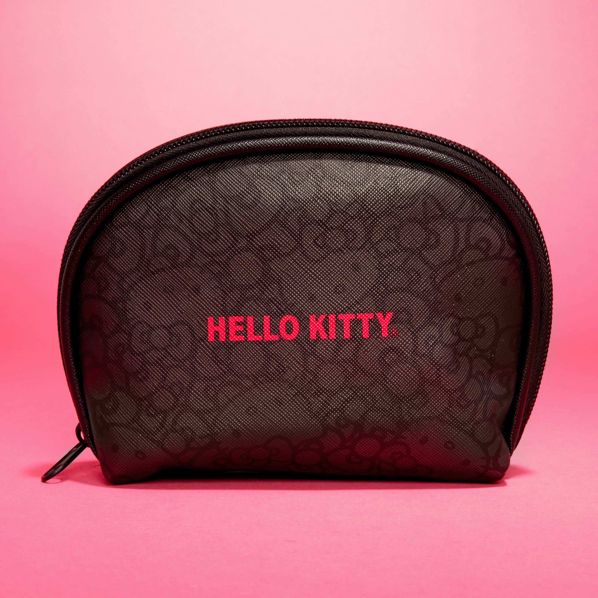 Monochromatic Hello Kitty zipper pouch in use, storing small essentials