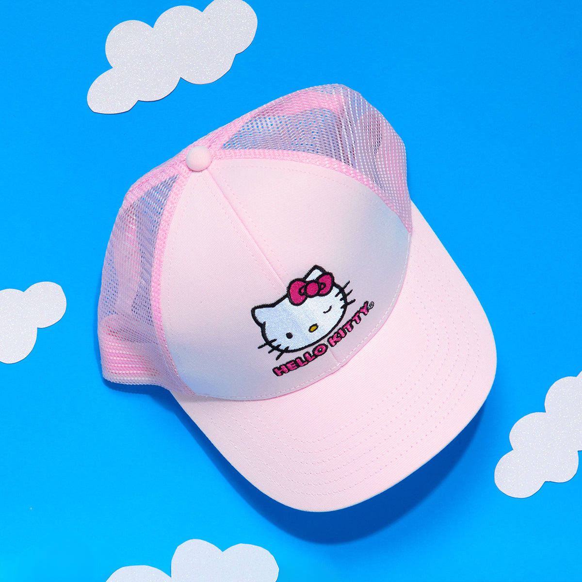 Side view of adjustable Hello Kitty trucker hat, showcasing its pink color.