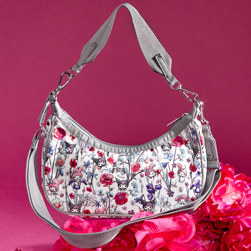 Close-up of the convertible hobo bag’s interior zippered pocket and lining