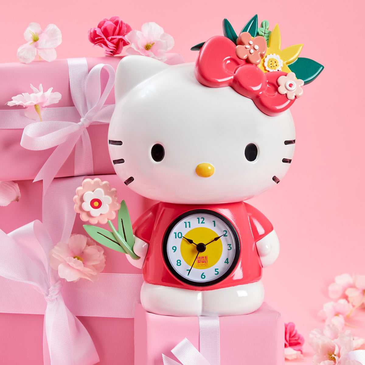 Side angle of retro desk clock showing Hello Kittys floral bow and resin craftsmanship