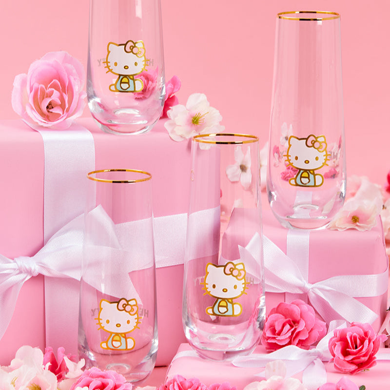 Set of four Hello Kitty glasses with gold accents, ideal for parties