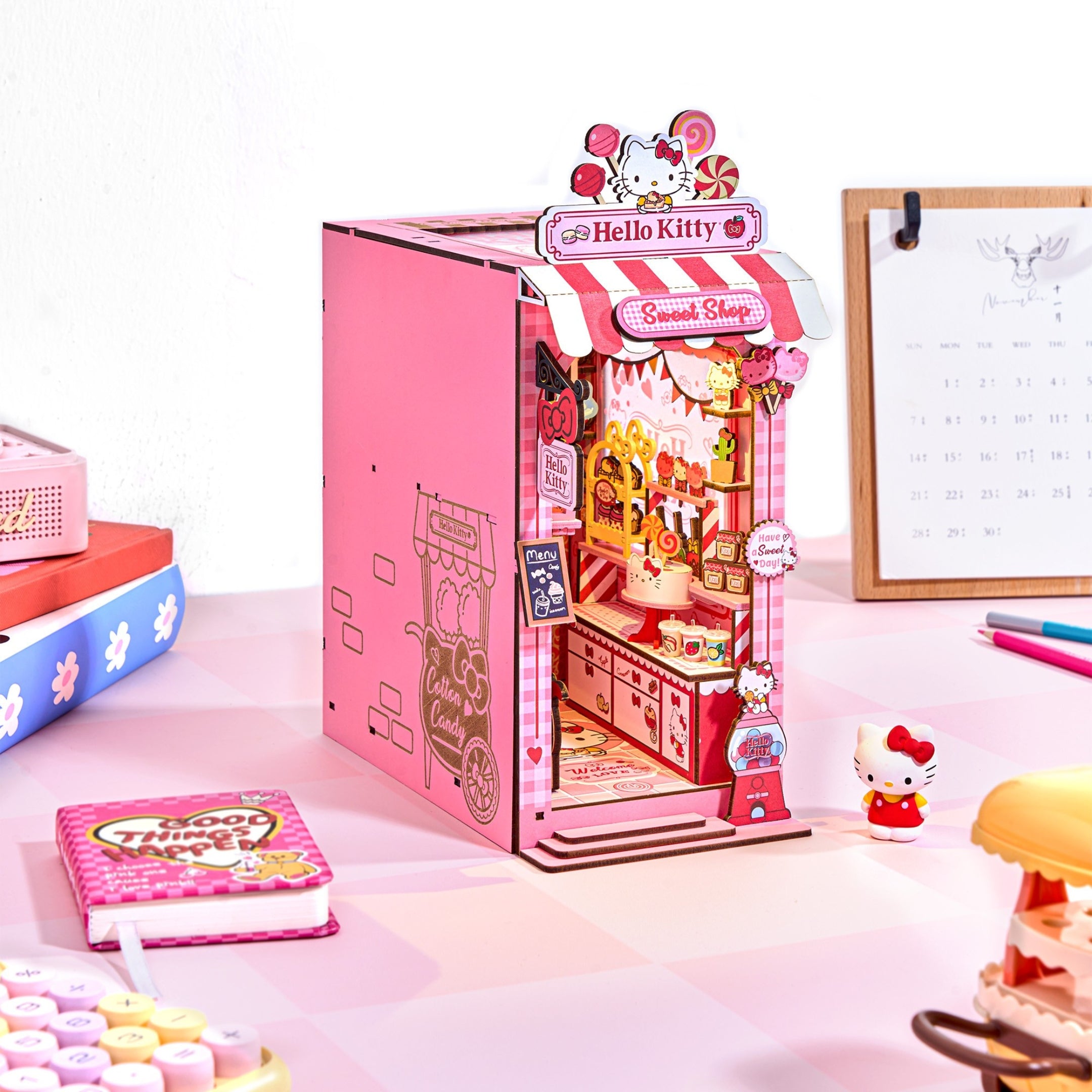 Assembled Hello Kitty candy shop book nook with glowing lollipop chandelier