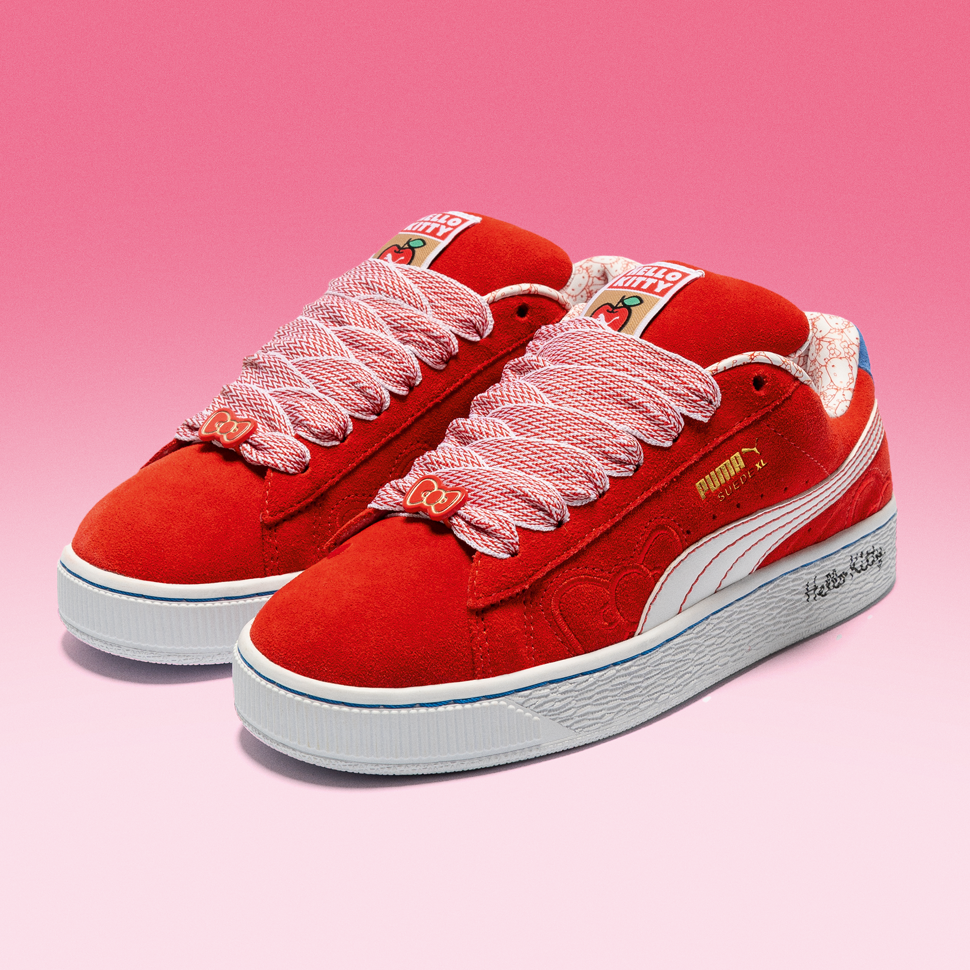 Hello Kitty x PUMA Womens Red Bow Suede XL Sneakers back view, featuring the Hello Kitty artwork on the heel