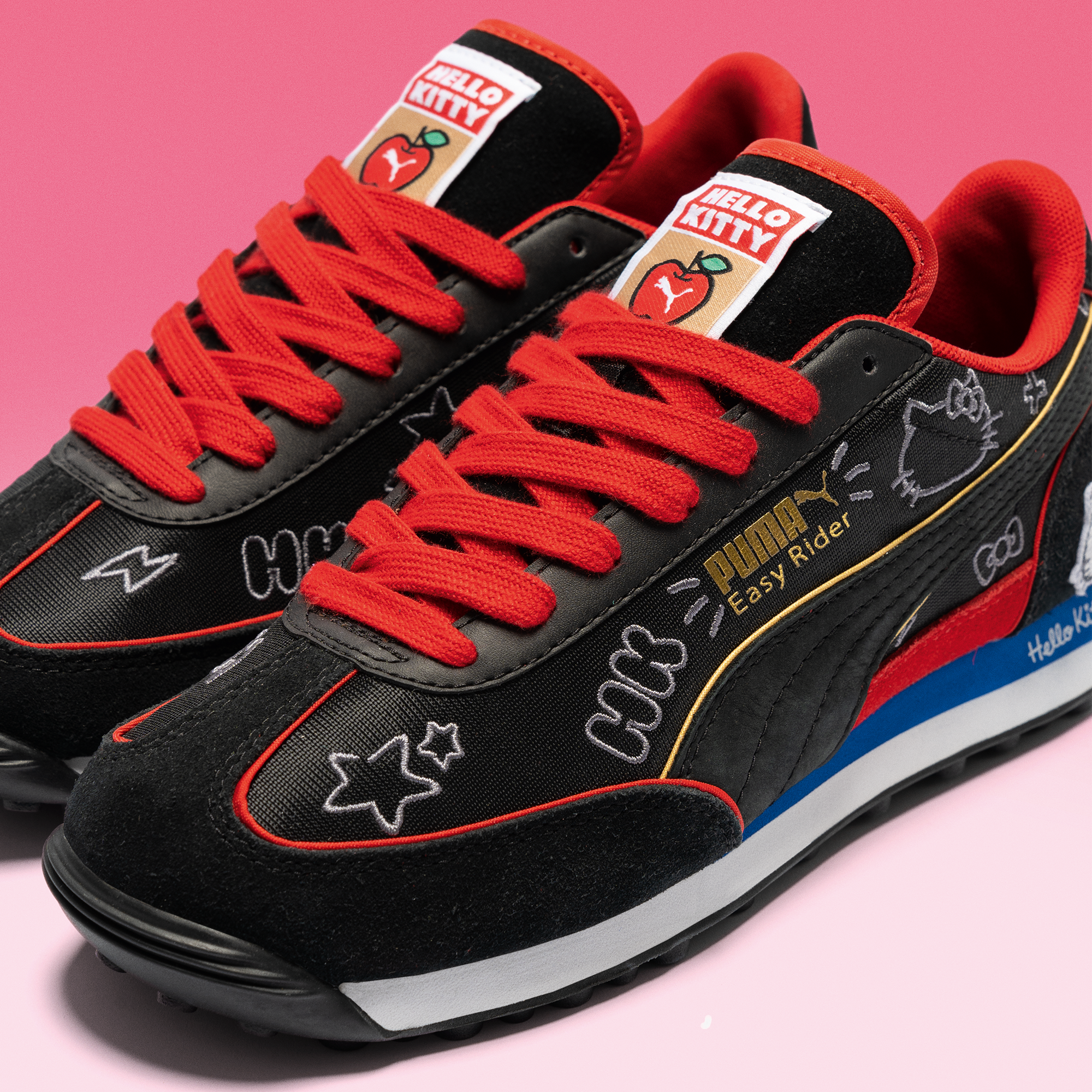 Close-up of PUMA branding and Hello Kitty artwork on shoe tongue