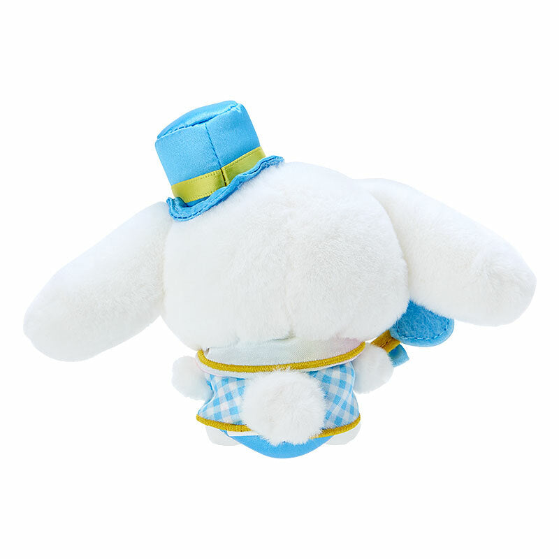 Side view of the plush toy showcasing the heart wand and bow details