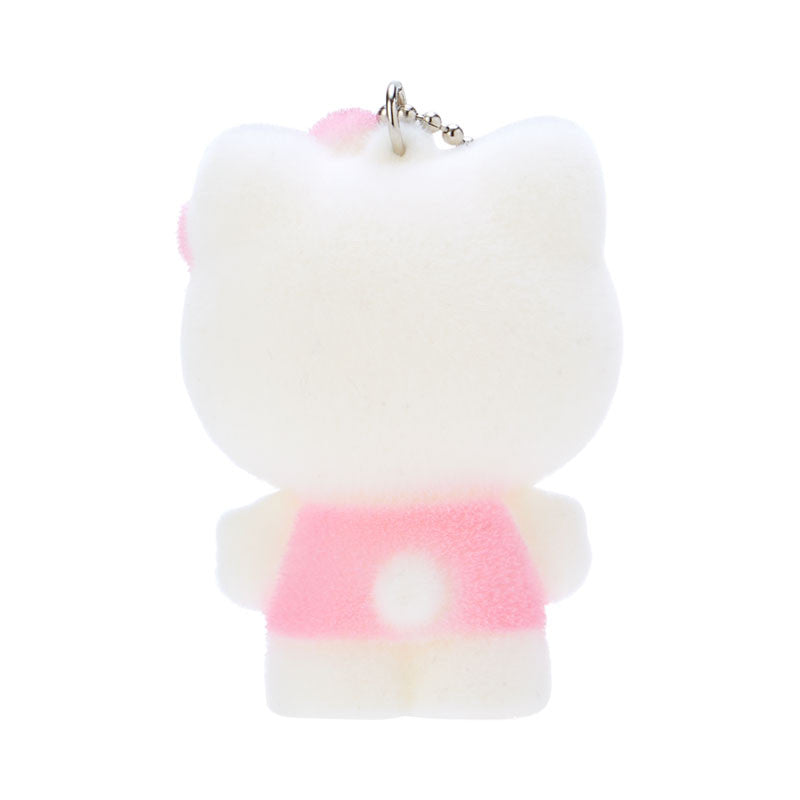 Hello Kitty plush keychain displayed on a colorful surface