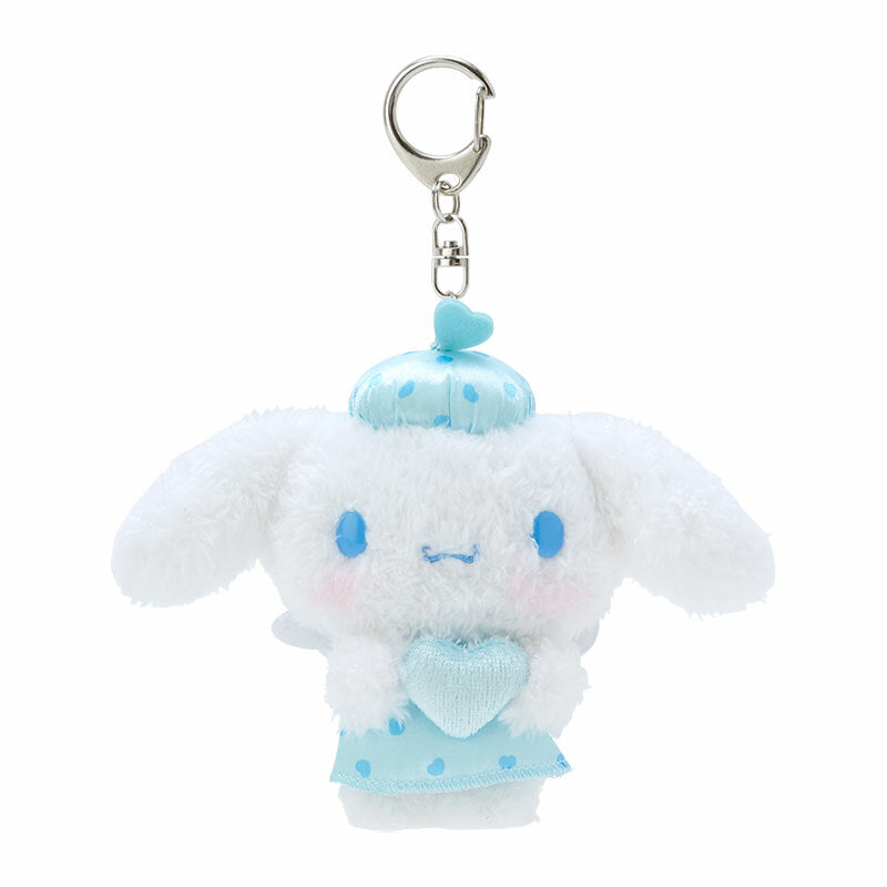 Close-up of Cinnamoroll plush keychain, showcasing wings and smile.