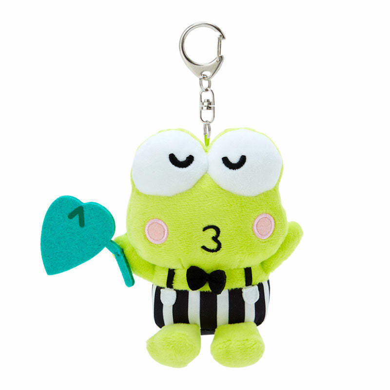 Keroppi plush keychain hanging from a denim backpack strap