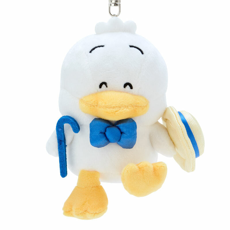 Closeup of plush keychain showcasing embroidered retro outfit details