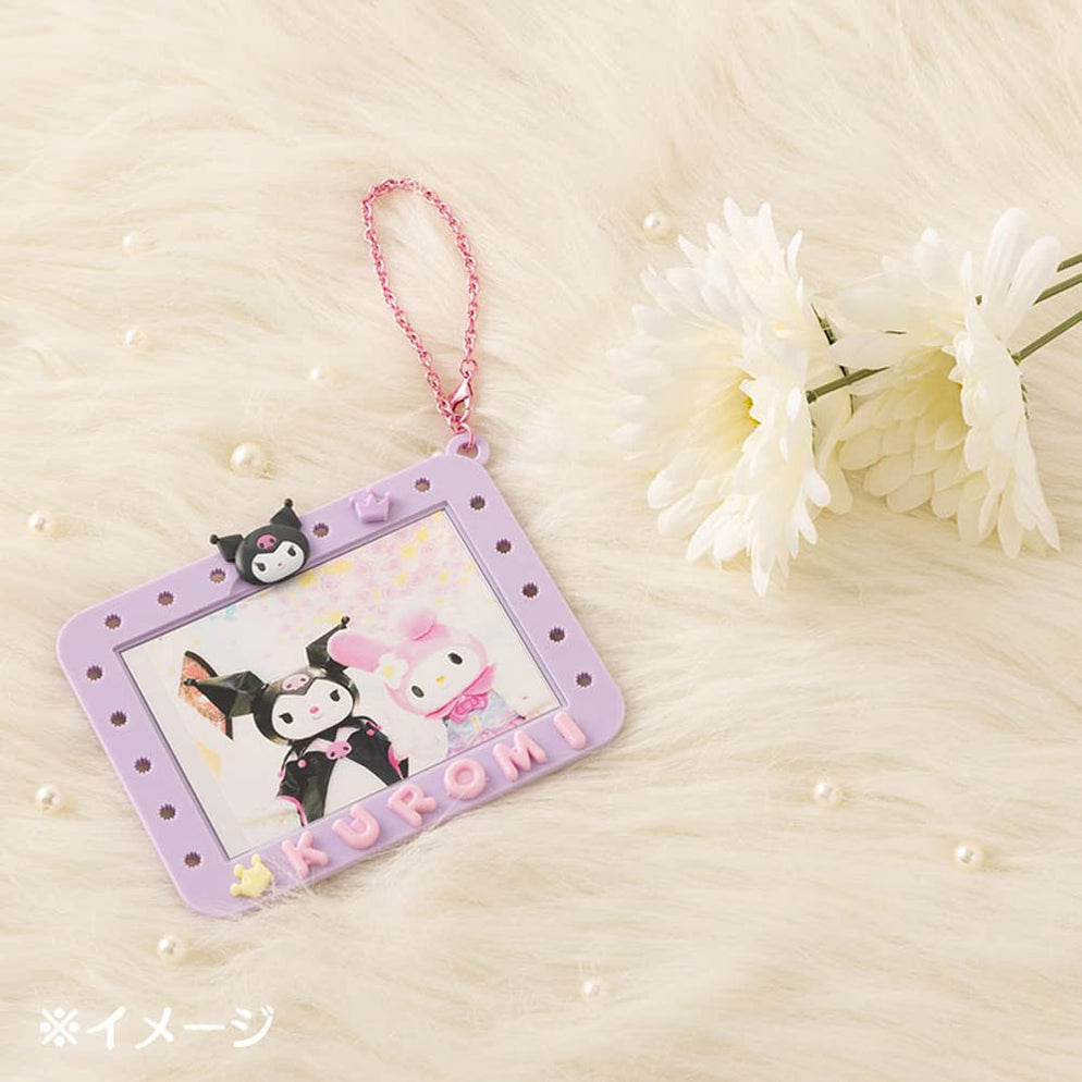 Front view of the Kuromi badge and holder with charms attached