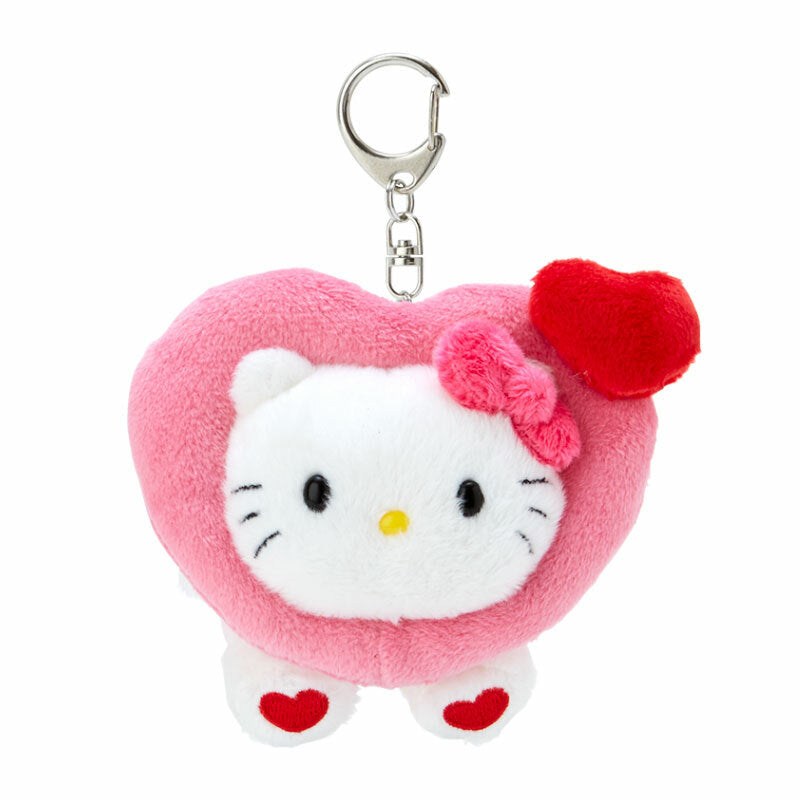 Closeup of Hello Kitty plush keychain with embroidered heart details.
