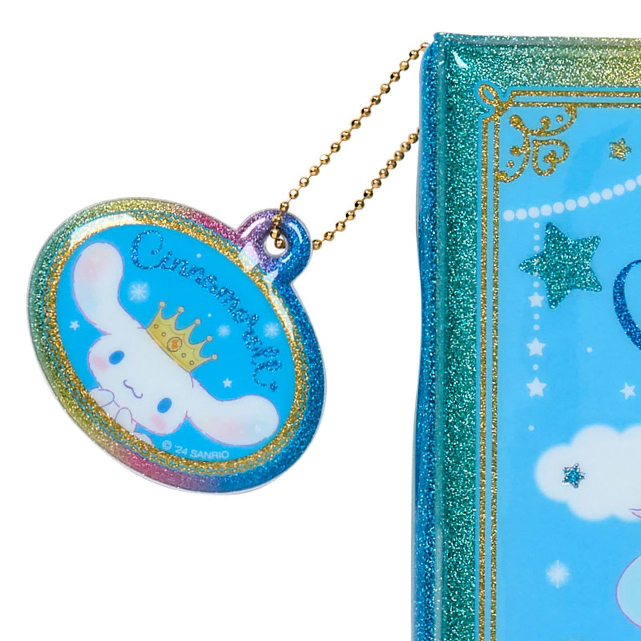 Close-up of the removable charm on the Cinnamoroll sticker book.