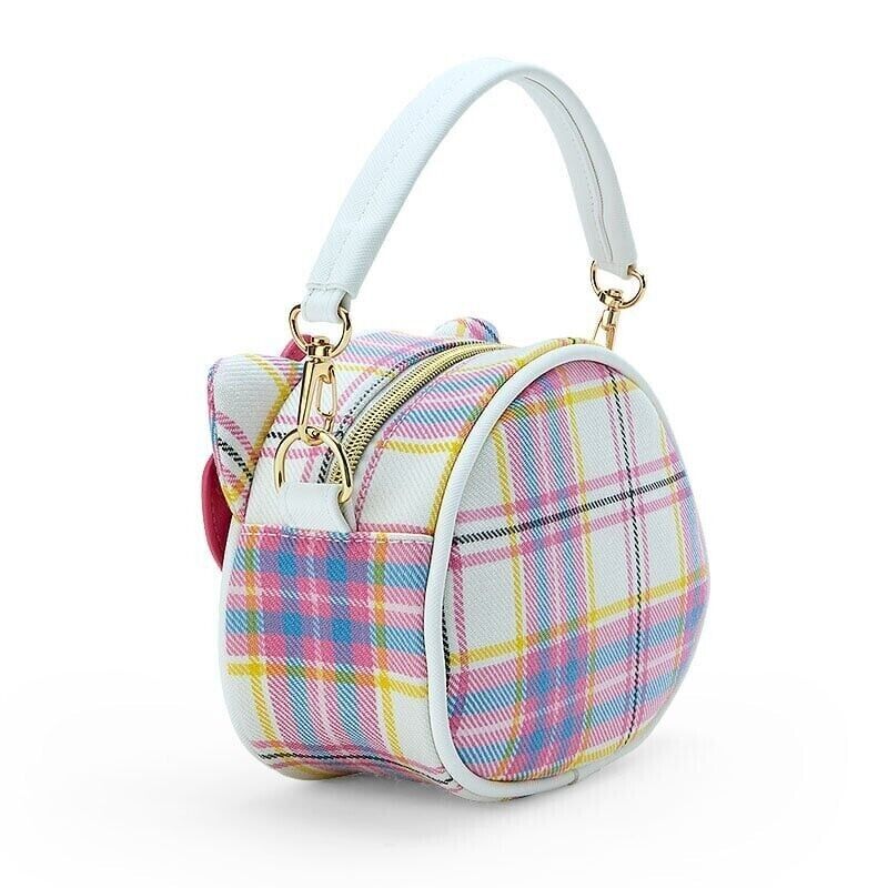 Close-up of the bags gold accented hardware and Hello Kitty signature