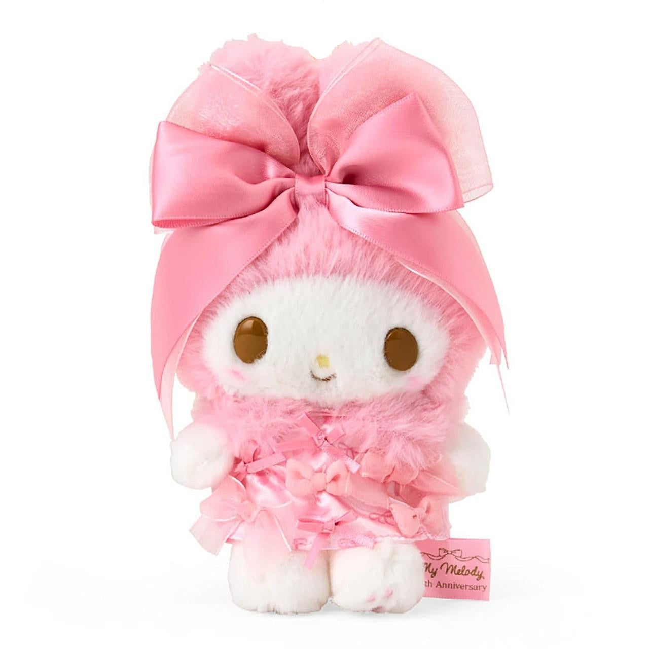 My Melody 50th anniversary plush keychain with ribbon accents and hand-painted cheeks, front view. My Melody 50th anniversary plush keychain with ribbon accents and hand-painted cheeks, front view.