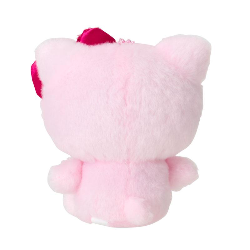 Hello Kitty plush attached to a backpack using its push clasp closure